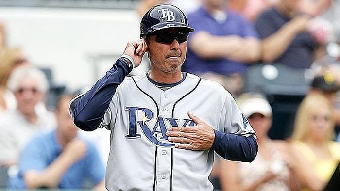 Baseball coach giving signals