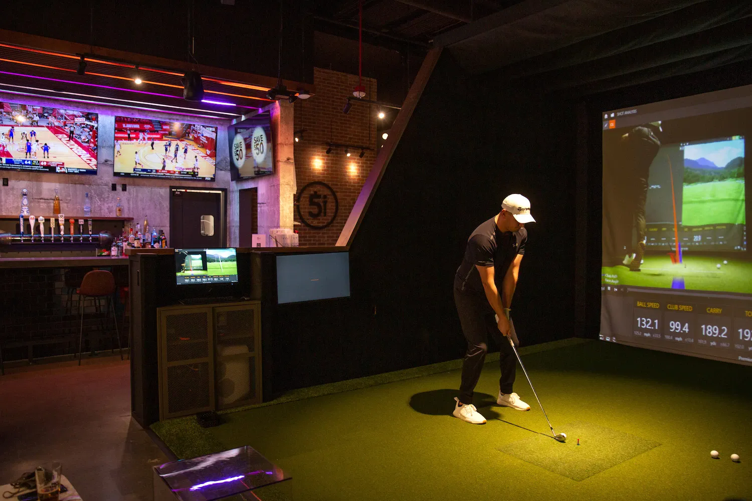Man engrossed in playing virtual golf