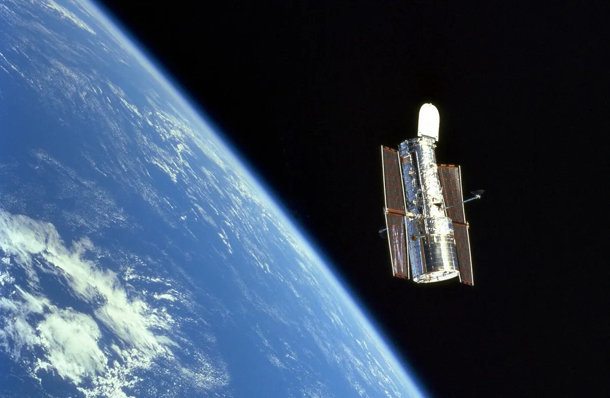 Hubble with the vast silent expanse of space in the background