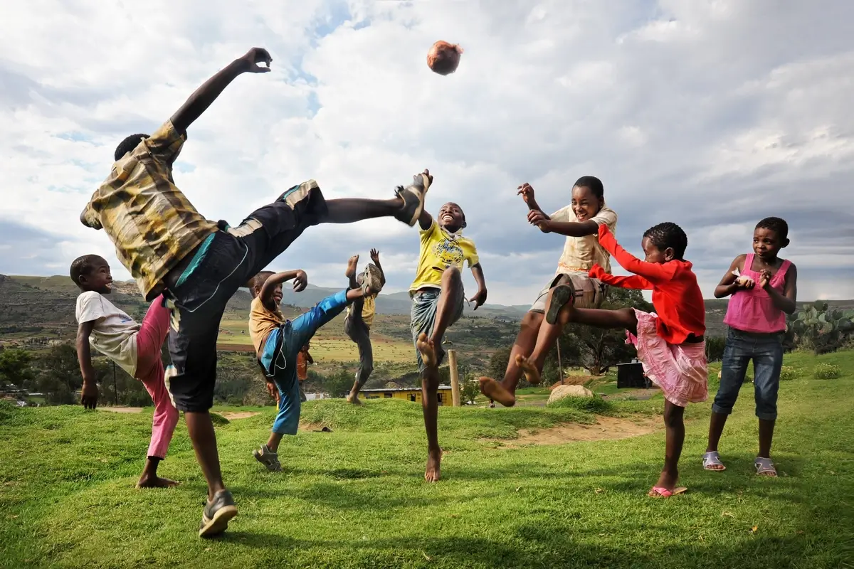 Children play soccer in Lesotho