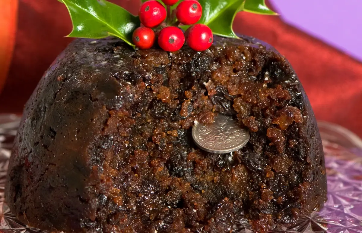 Christmas pudding with a gold coin peeking out