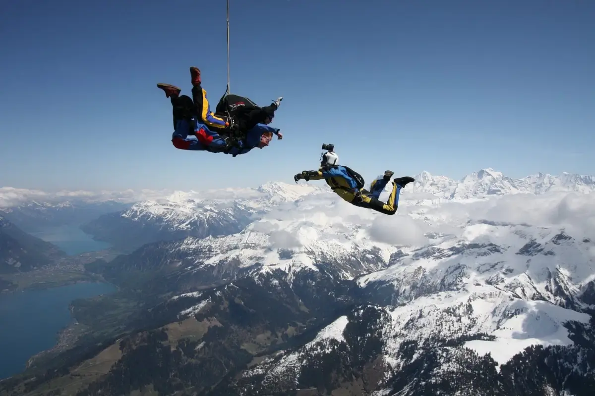 Skydivers over the Swiss alps