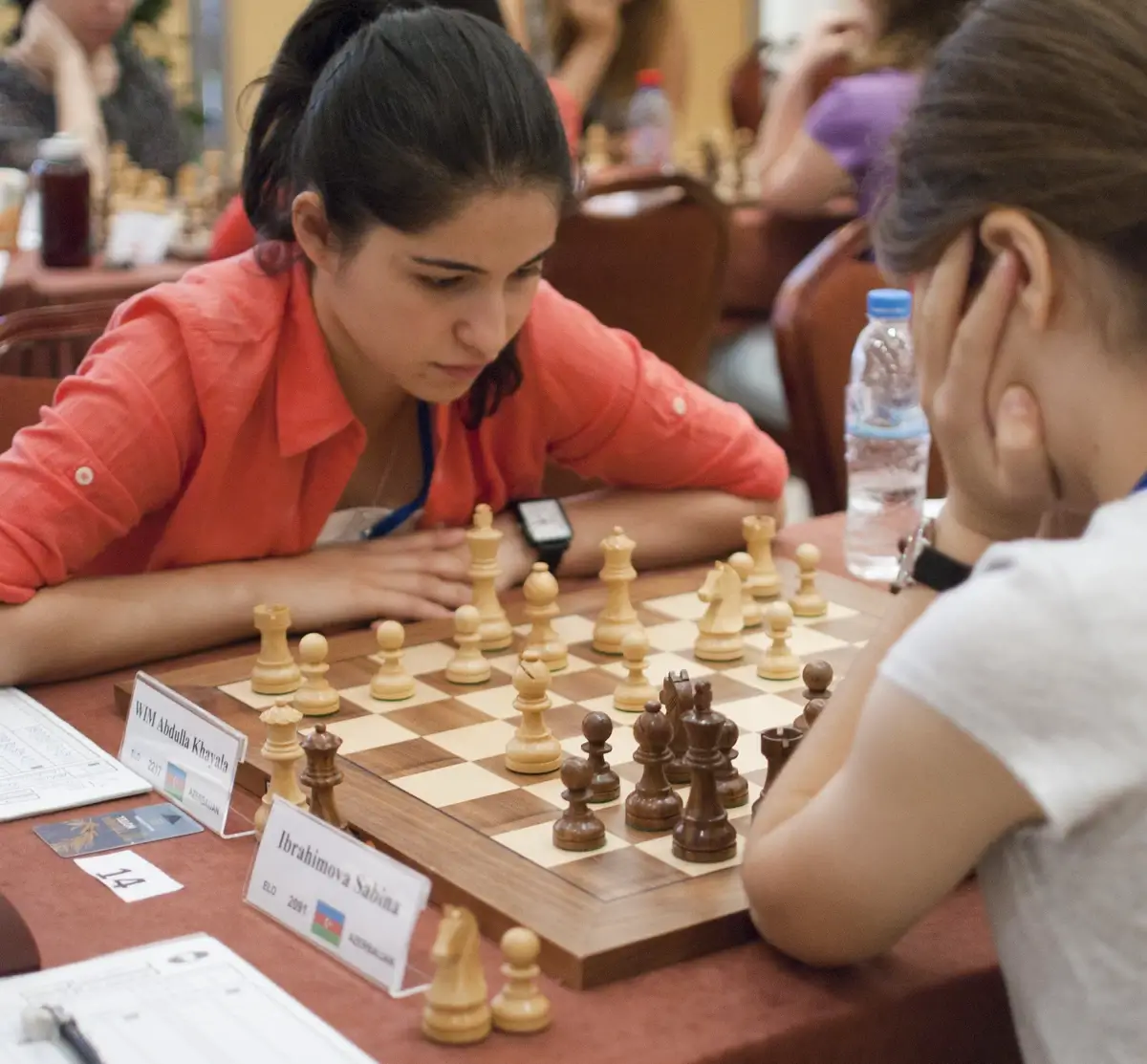 Young Azerbaijani students engrossed in a chess match
