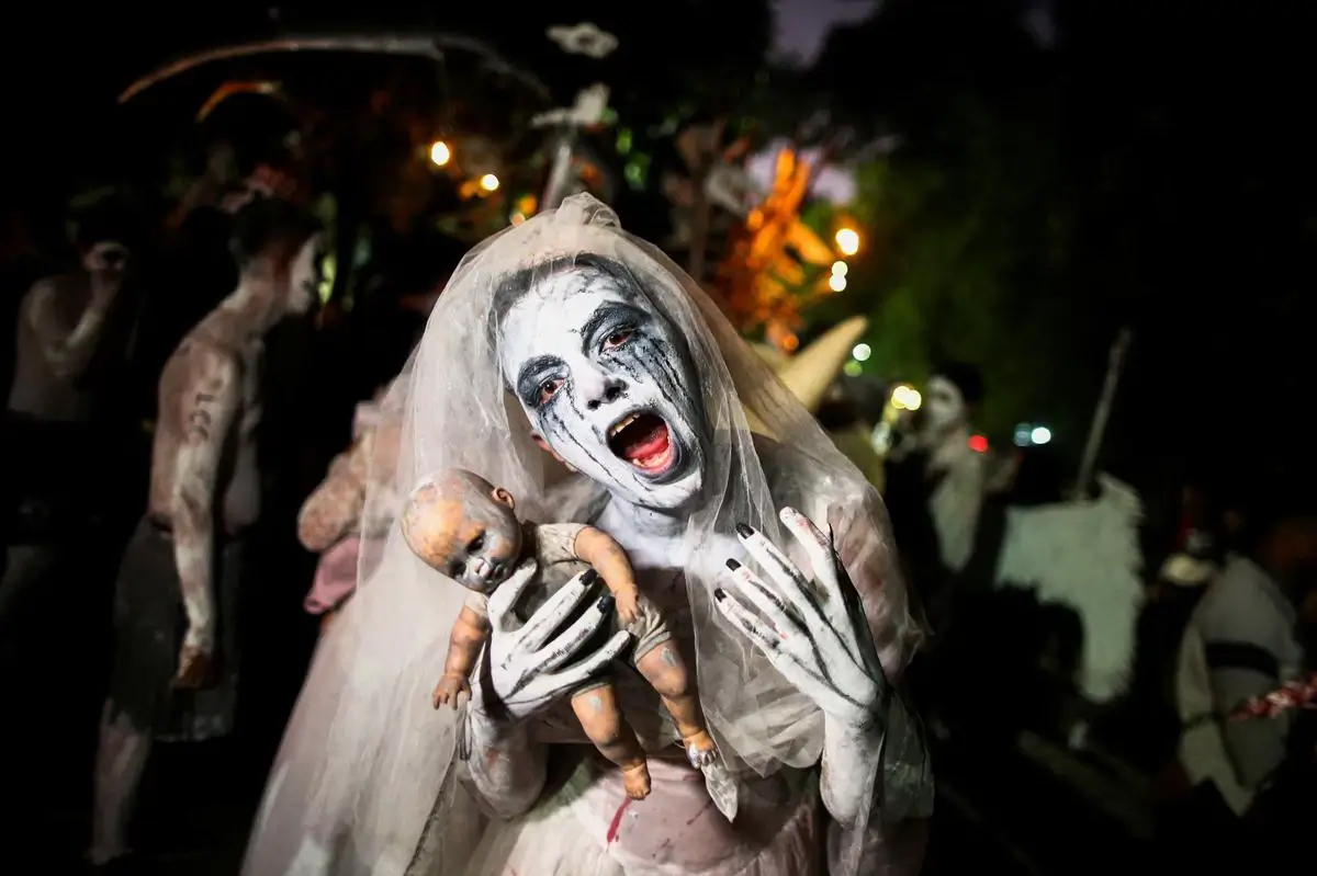 Performer dressed as La Llorona during Day of the Dead procession
