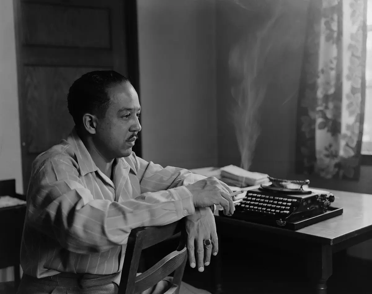 Langston Hughes smokes in thought