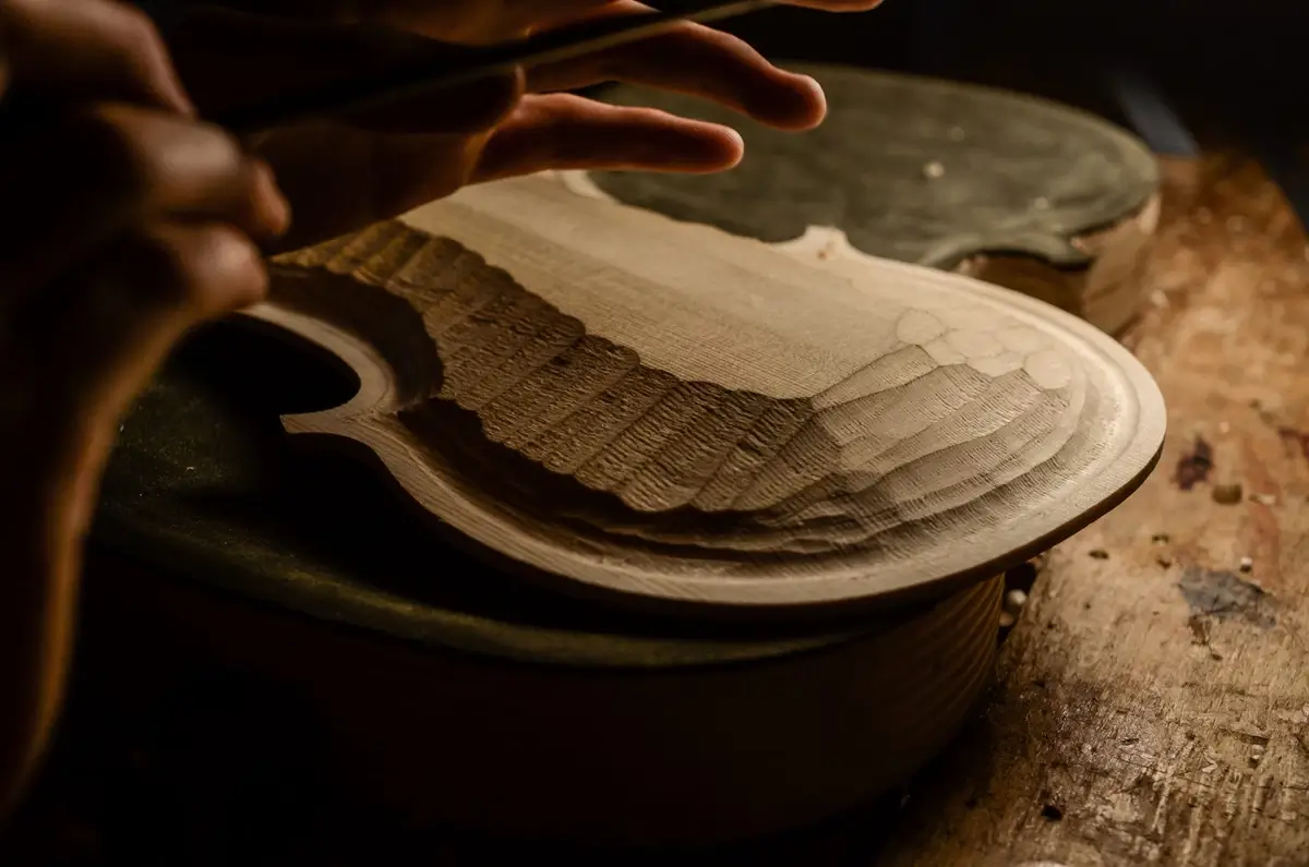 Carving in the production of the violin