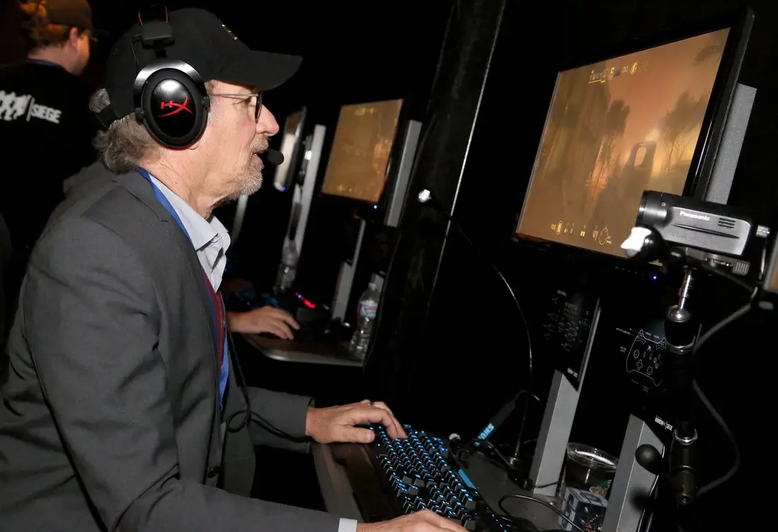 Steven Spielberg plays a video game on the computer