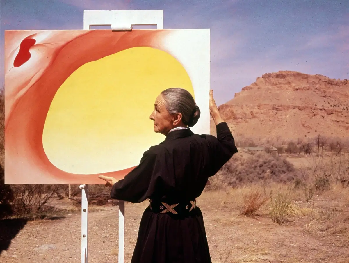 Tony Vaccaro's photograph of Georgia O'Keeffe with "Pelvis Series, Red with Yellow" in 1960