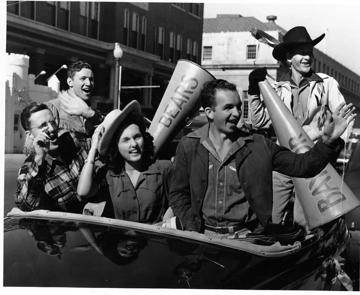 Students join in on the homecoming festivities as part of the parade in 1940