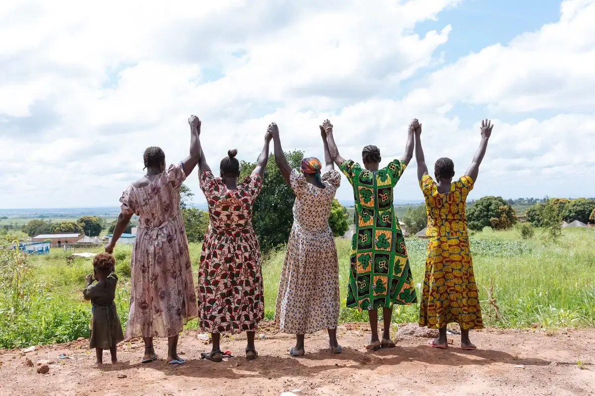 Ugandan women in long dresses