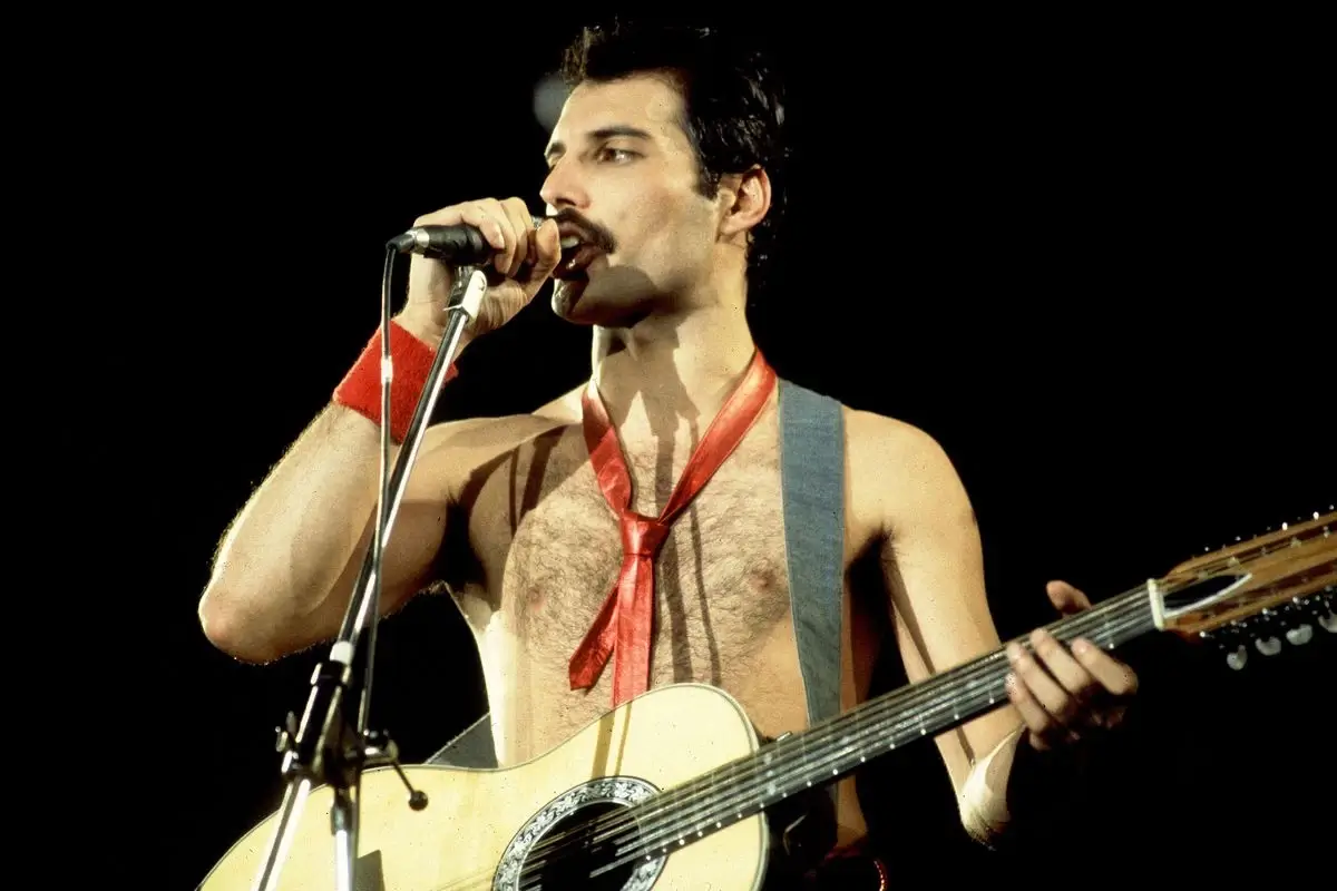 Freddie Mercury with a guitar
