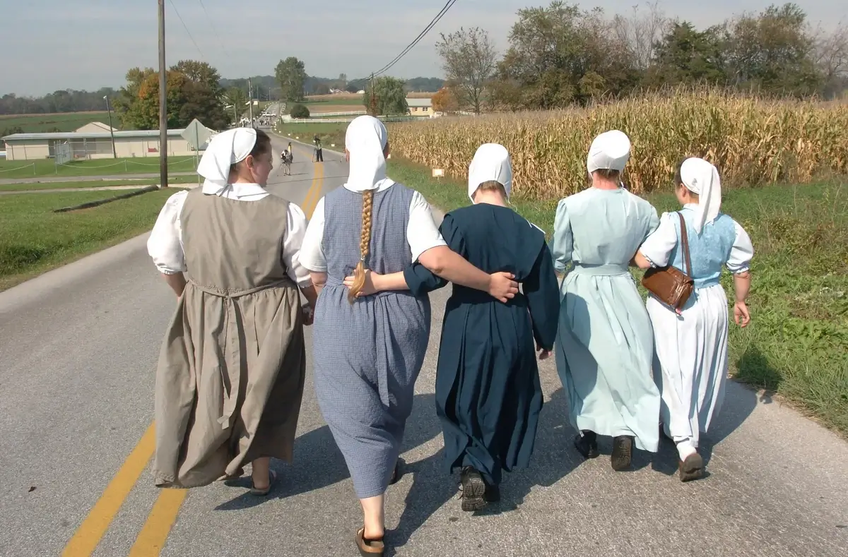 Amish women walking along the road