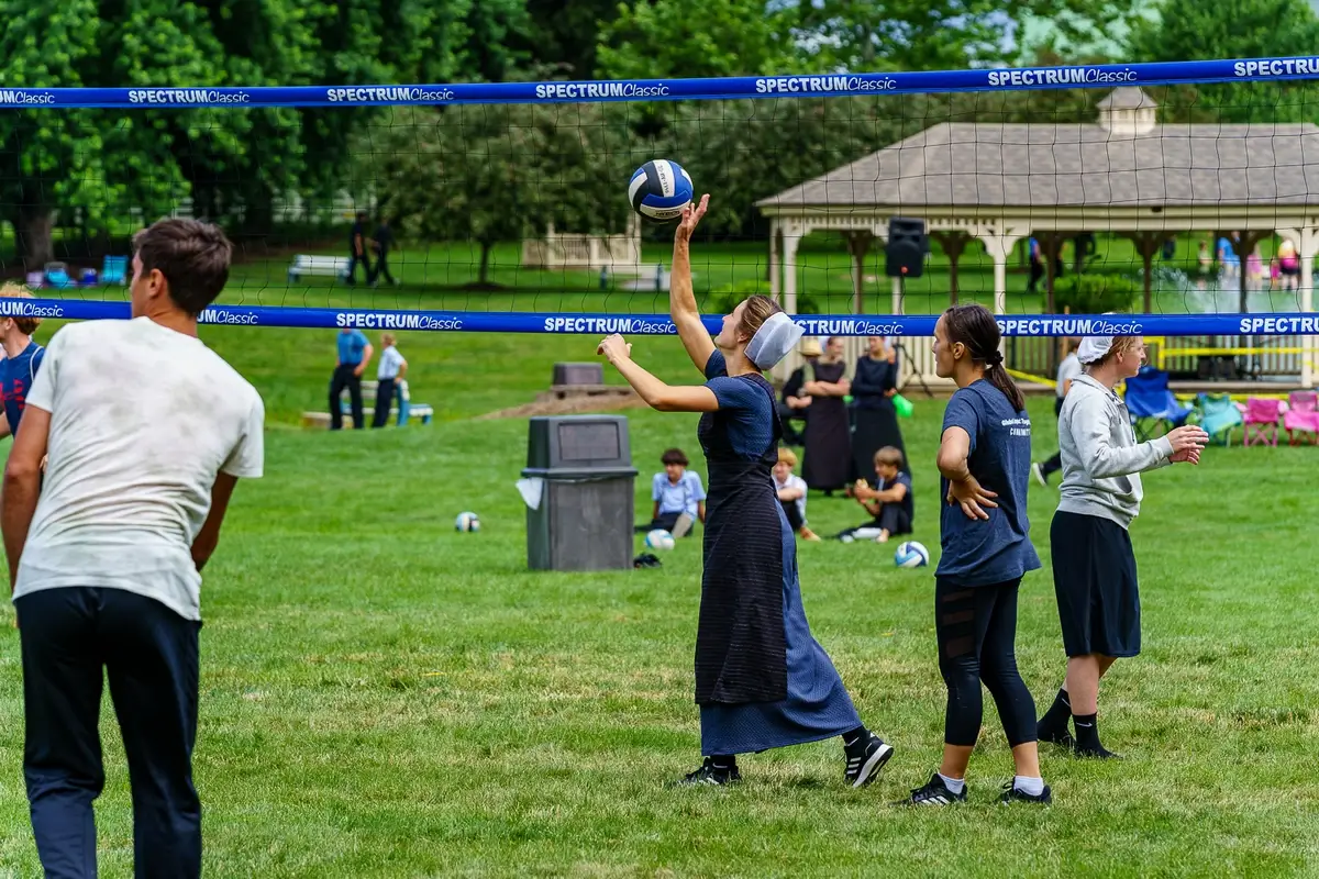 Both Amish and non-Amish youths play volleyball