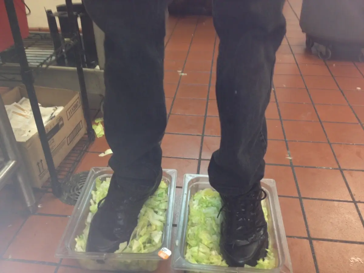 The viral 4chan post showing the employee standing in the lettuce trays