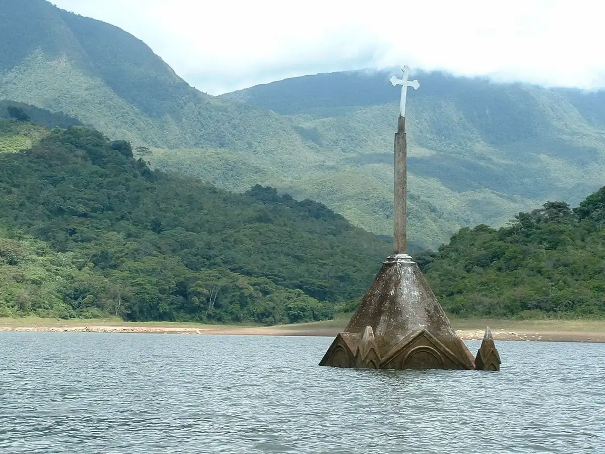 The bell tower of Potosí's church emerging from the reservoir waters